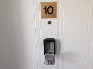 a door with a phone sticking out of it at Aberdeen Serviced Apartments - Bloomfield in Aberdeen
