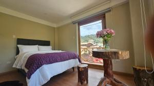 A bed or beds in a room at Amaru TreeHouse