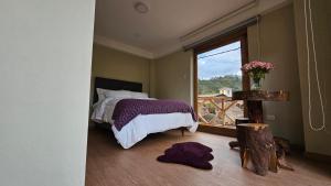 A bed or beds in a room at Amaru TreeHouse