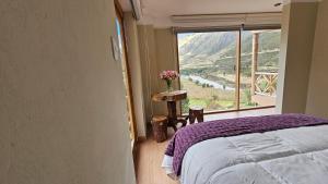A bed or beds in a room at Amaru TreeHouse