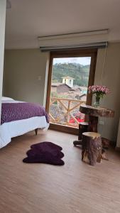 A bed or beds in a room at Amaru TreeHouse