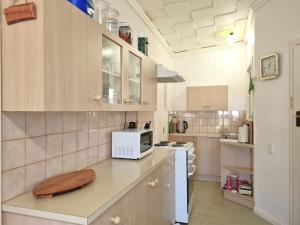 a kitchen with a counter top with a microwave at Catalina Cottage in Port Moonta