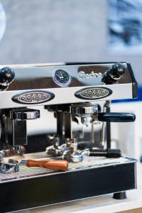 a coffee machine with a hot dog on it at Hotel LIV in Birmingham
