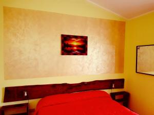 Postel nebo postele na pokoji v ubytování B&B Antica Trattoria