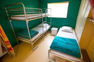 Postel nebo postele na pokoji v ubytování Camping 3 étoiles - Parc aquatique - ccbbaia