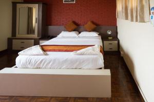 En eller flere senge i et værelse på Planet Bhaktapur Hotel