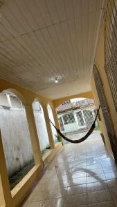a room with a hammock in a building at Pousada Pôr do sol in Belém