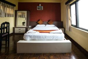 Voodi või voodid majutusasutuse Planet Bhaktapur Hotel toas
