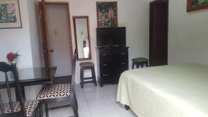 Postelja oz. postelje v sobi nastanitve Firefly Beach Cottages
