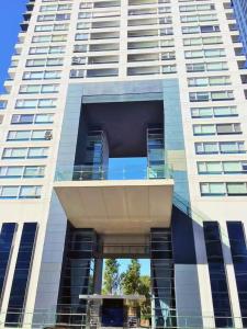 a tall building with a balcony in front of it at Foster Yacht Suites in Buenos Aires