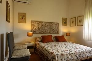 a bedroom with a bed and two lamps and a window at Villa Le Due Spiagge in Chia +36 photos