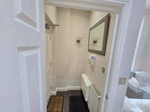 a hallway with a stairway leading to a bedroom at Exquisite 2 Bedroom Apartment in Sheffield +8 photos