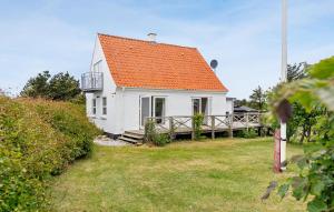 a white house with an orange roof at 5 Bedroom Awesome Home In Vestervig in Vestervig +30 photos