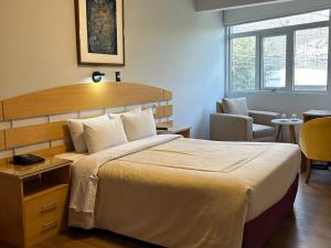 A bed or beds in a room at HOTEL Javier Prado Inn