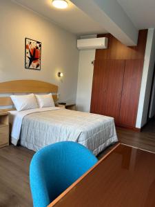 A bed or beds in a room at HOTEL Javier Prado Inn