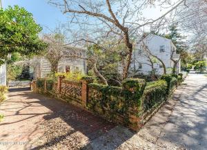 a brick fence in front of a house at Captains Courtyard - Heart of Historic Downtown Wilmington - 48 Firepit - Turf Yard in Wilmington