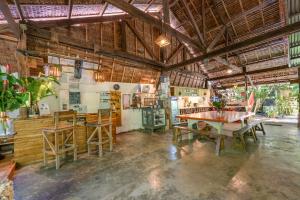a large room with a table and chairs in it at Soffta Surf Ranch in General Luna +87 photos