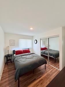 a bedroom with two beds and a mirror at Comfortable Family Getaway! in Cheyenne