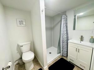 a bathroom with a toilet and a sink and a shower at Comfortable Family Getaway! in Cheyenne +15 photos