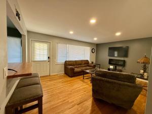 a living room with a couch and a table at Comfortable Family Getaway! in Cheyenne