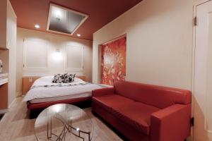 Postel nebo postele na pokoji v ubytování Asahikawa Hotel UNION-Adult Only