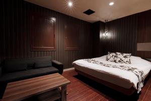 Postel nebo postele na pokoji v ubytování Asahikawa Hotel UNION-Adult Only + 20 fotografií