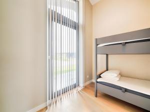 Ένα ή περισσότερα κρεβάτια σε δωμάτιο στο Holiday Home in Oud Ade near Kaag Lakes