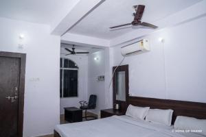 Postel nebo postele na pokoji v ubytování hotel gp grand