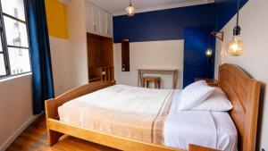 Voodi või voodid majutusasutuse Community Hostel Quito toas