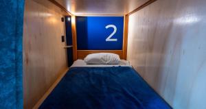Voodi või voodid majutusasutuse Community Hostel Quito toas