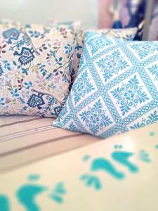 a group of pillows sitting on top of a table at B&B Olbia in Olbia