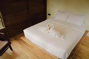 Voodi või voodid majutusasutuse Bali Secret Jungle toas