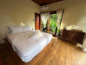 Voodi või voodid majutusasutuse Bali Secret Jungle toas