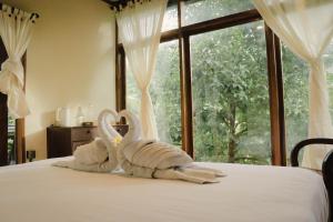 Voodi või voodid majutusasutuse Bali Secret Jungle toas