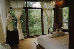 Voodi või voodid majutusasutuse Bali Secret Jungle toas