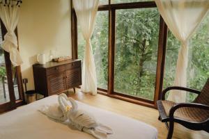 Voodi või voodid majutusasutuse Bali Secret Jungle toas