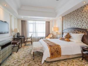 Ένα ή περισσότερα κρεβάτια σε δωμάτιο στο Jinjiang Grandlink Hotel +201 φωτογραφίες