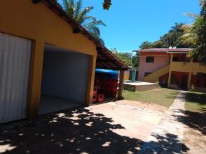 a garage door on the side of a house at Casa hostel in Ilhéus