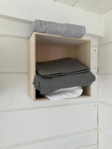 a cupboard with a bed in a room at Dammstugan 