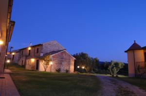a night view of a barn and a building at Agriturismo Due Torri in Chiaravalle Centrale