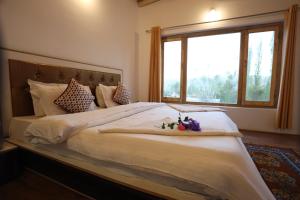 Postel nebo postele na pokoji v ubytování Stanzin Manepa Homestay