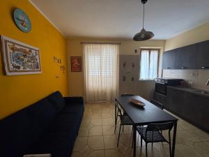 a living room with a couch and a table at The Reed in Mazzarino