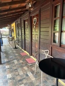 a row of tables and chairs on a building at Canoa Ilha Grande in Abraão +9 photos