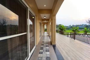 a balcony of a house with a view at Jashn Wellness Resort Lucknow in Lucknow