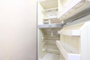 an empty refrigerator with its door open at Greenchair AMANO in Yamanakako +25 photos