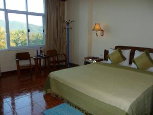 Postel nebo postele na pokoji v ubytování Dokchampa Hotel + 75 fotografií