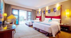 Postel nebo postele na pokoji v ubytování Ocean Spring Metropark Hotel Zhuhai