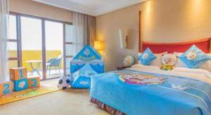 Postel nebo postele na pokoji v ubytování Ocean Spring Metropark Hotel Zhuhai