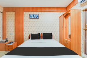 Postel nebo postele na pokoji v ubytování Super Hotel O Airport Road Coimbatore