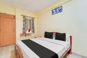 Postel nebo postele na pokoji v ubytování Super Hotel O Airport Road Coimbatore